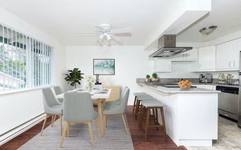 Dining area near kitchen with window